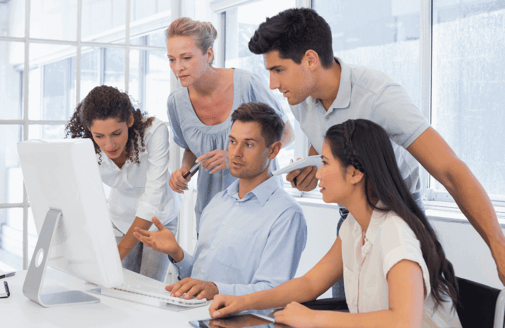 business team assessing content on computer