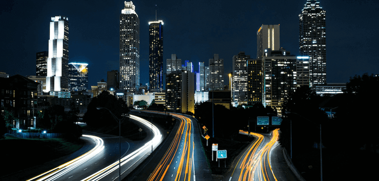 image of a city by night and fast traffic (1) (1)